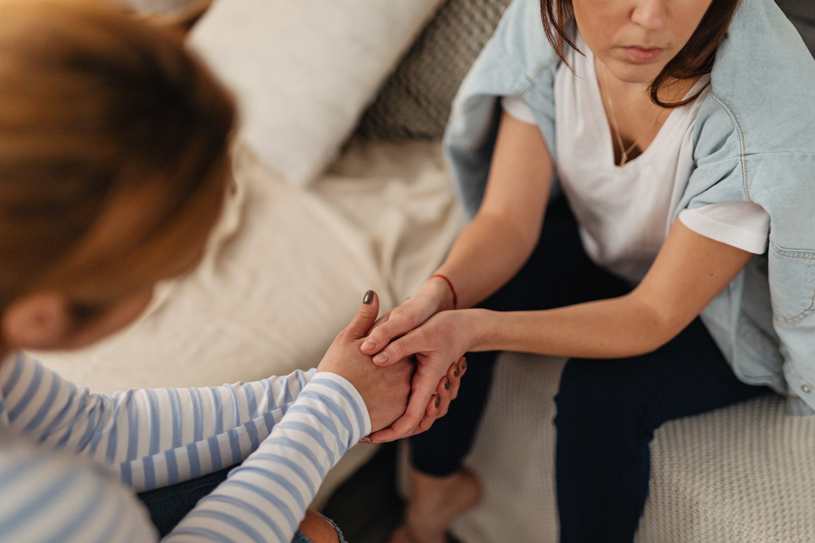 Women Holding Hands